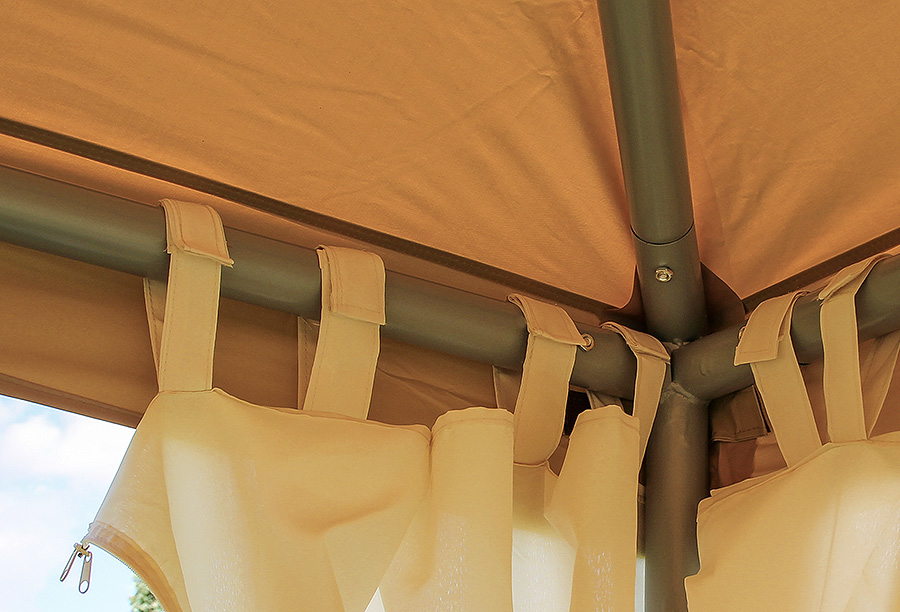 Detailed view of a beige-coloured pavilion roof with side sections attached to the frame with Velcro.