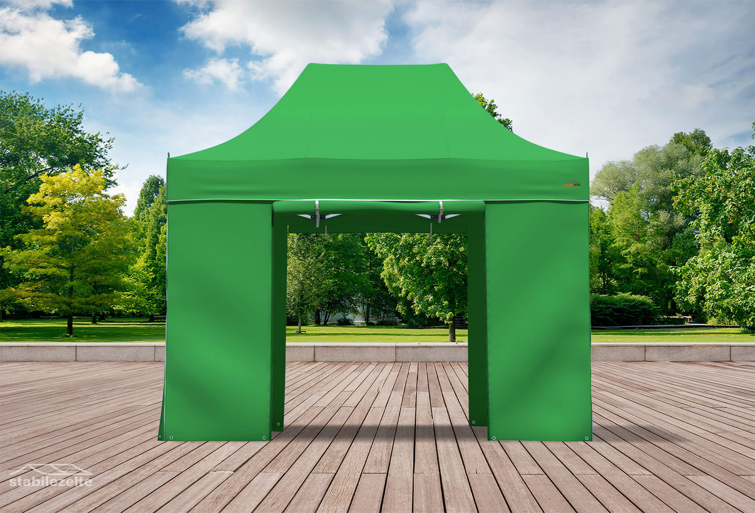 Grüner Faltpavillon mit geöffneten Türen 3 x 2m in einem Park